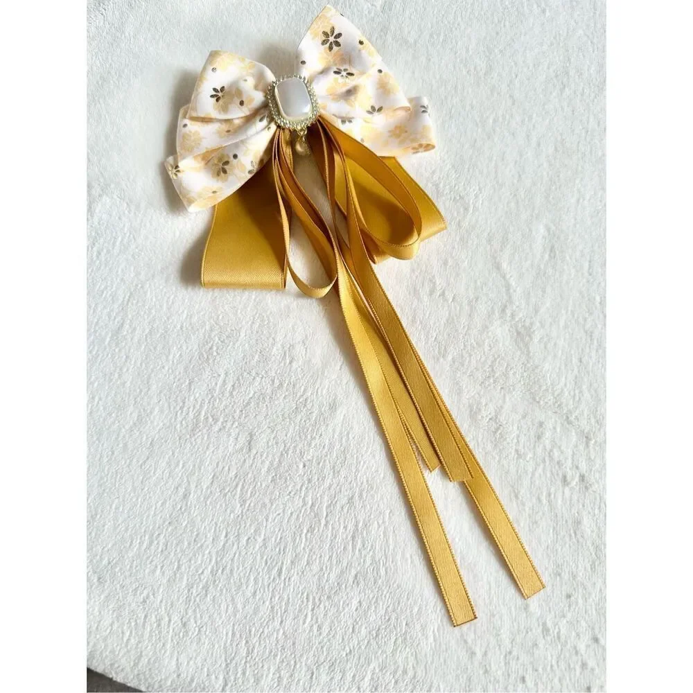 Adorable floral yellow hair bow with floral and pearl accents with hair Barrette